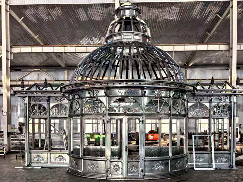 Front view galvanized steel dome conservatory frame ornate decorative steel tracery factory workshop